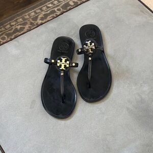 Tory Burch Black Jelly Flip Flops with Gold Emblem